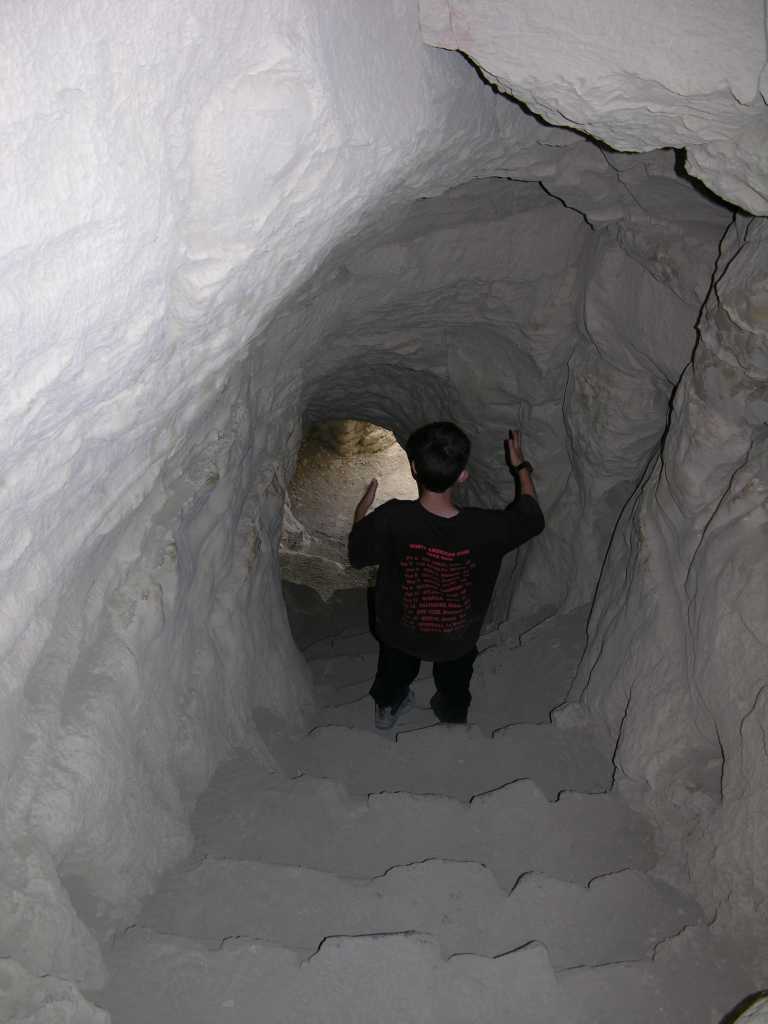 Tibet Guge 08 Tsaparang 08 Tunnels Up To One of the caves proved to be the entrance to a tunnel; that led upwards in a wide curve inside the rock, from time to time lit up by narrow openings in the outer rock-wall. - Lama Anagarika Govinda: The Way of the White Clouds.